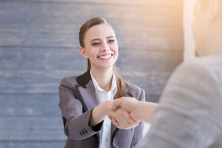 girl shaking hands in an interview
